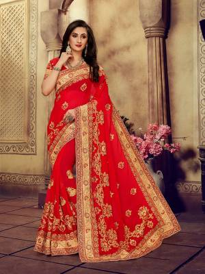 For The Upcoming Wedding Season, Here Is a Perfectly Suitable Saree In Red Color Paired With Red Colored Blouse. This Saree And Blouse Are fabricated On Georgette Beautified With Embroidery Highlighted With Stone Work. Buy This Beautiful Designer Saree Now.
