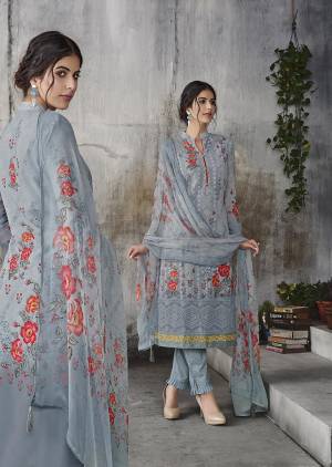Flaunt Your Rich And Elegant Taste Wearing This Designer Straight Suit In Grey Color. Its Top IS Fabricated on Georgette Beautified With Lakhnavi Work And Digital Prints, Paired With Santoon Bottom And Chiffon Fabricated Dupatta. 