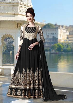 Get Ready For The Upcoming Festive And Wedding Season With This Heavy Designer Floor Length Suit In Black Color. Its Heavy Embroidered Top Is Fabricated On Georgette Paired With Santoon Bottom and Chiffon Fabricated Dupatta. All Its Fabrics Ensures Superb Comfort Throughout The Gala. Buy Now.