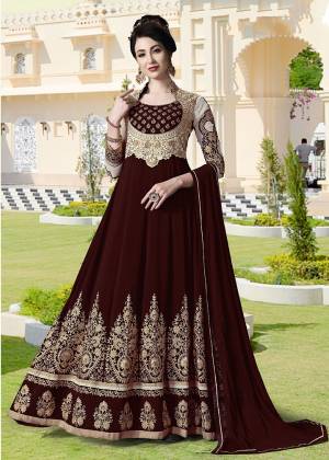 Get Ready For The Upcoming Festive And Wedding Season With This Heavy Designer Floor Length Suit In Maroon Color. Its Heavy Embroidered Top Is Fabricated On Georgette Paired With Santoon Bottom and Chiffon Fabricated Dupatta. All Its Fabrics Ensures Superb Comfort Throughout The Gala. Buy Now.