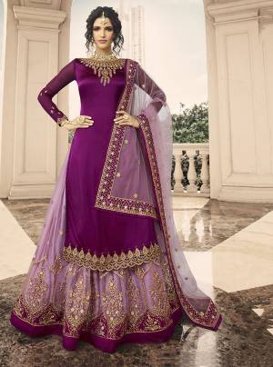 Shine Bright Wearing This Designer Lehenga Suit In Purple Colored Top Paired With Lilac Colored Lehenga And Dupatta. Its Top Is Fabricated On Satin Georgette Paired With Net Lehenga And Dupatta. 