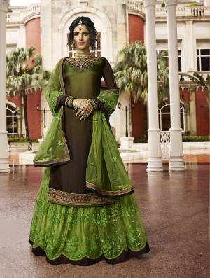 Celebrate This Festive And Wedding Season With This designer Indo-Western Lehenga Suit In Brown Colored Top Paired With Contrasting Green Colored Lehenga And Dupatta. Its Top Is Satin Georgette Based Paired With Net Fabricated Lehenga And Dupatta.