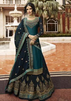 Beautiful Shade In Blue Is Here To Add Into Your Wardrobe With This Indo-Western Lehenga Suit In Teal Blue Color. Its Top Is Fabricated On Satin Georgette Paired With Heavy Embroidered Georgette Fabricated Lehenga And Dupatta. Buy Now.