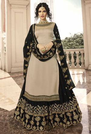 Flaunt Your Rich And Elegant Taste With Such Design And Elegant Color Pallete. Grab This Indo Western Lehenga Suit In Sand Beige Colored Top Paired With Black Colored Lehenga and Dupatta. Its Top Is Fabricated On Satin Georgette Paired With Georgette Fabricated Lehenga And Dupatta. 