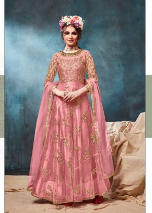 Get Ready For The Upcoming Wedding And Festive Season With This Heavy Designer Floor Length Suit In Pink Color. Its Heavy Embroidered op Is Fabricated On Net Paired With Santoon Bottom And Net Fabricated Dupatta. Buy Now.