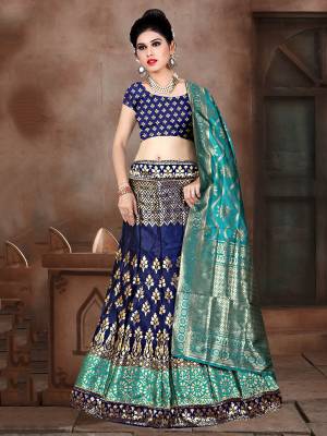 Go With Pretty Shades Of Blue Wearing This Heavy Weaved Designer Lehenga Choli In Navy Blue Color Paired With Blue Colored Dupatta. Its Blouse Is Fabricated On Banarasi Art Silk Paired With Banarasi Jacquard Silk  Lehenga And Dupatta. 