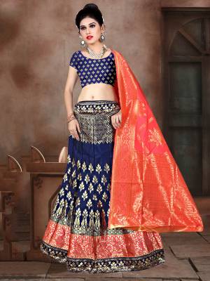 Look Pretty In This Designer Silk Based Lehenga Choli In Navy Blue Color Paired With Contrasting Fuschia Pink Colored Dupatta. It Is Fabricated On Banarasi Jacquard Silk Beautified With Weave All Over. Buy This Pretty Piece Now.