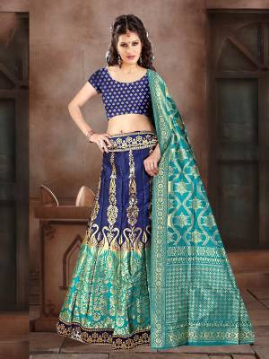 Go With Pretty Shades Of Blue Wearing This Heavy Weaved Designer Lehenga Choli In Navy Blue Color Paired With Blue Colored Dupatta. Its Blouse Is Fabricated On Banarasi Art Silk Paired With Banarasi Jacquard Silk  Lehenga And Dupatta. 