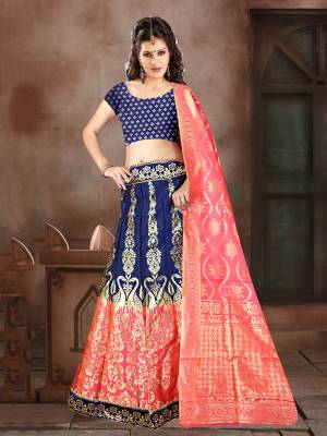 Look Pretty In This Designer Silk Based Lehenga Choli In Navy Blue Color Paired With Contrasting Fuschia Pink Colored Dupatta. It Is Fabricated On Banarasi Jacquard Silk Beautified With Weave All Over. Buy This Pretty Piece Now.
