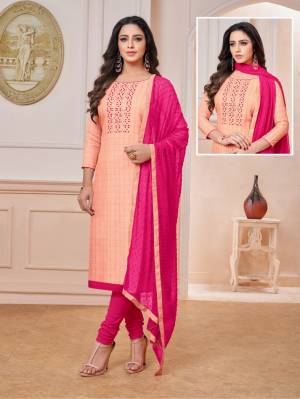 Here Is a Very Pretty Color Pallete With This Designer Dress Material In Peach Colored Top Paired with Contrasting Dark Pink Colored Bottom And Dupatta. Its Top Checks Top IS Rayon Based Paired With Cotton Bottom And Chiffon Fabricated Dupatta.