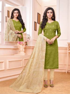 Enhance Your Personality Wearing This Designer Staright Suit In Green Colored Top Paired With Cream Colored Bottom And Dupatta. Its Top And Bottom Are Cotton Based Paired With Embroidered Cotton Silk Dupatta. 