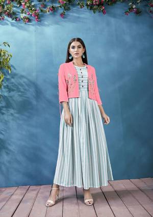 This Festive Season Celebrate With Beauty And Comfort Wearing This Readymade Kurti In Light Blue And White Color Paired With Pink Colored Jacket. This Pretty Lining Printed Kurti Is Fabricated On Handloom Cotton Paired With Rayon Fabricated Embroidered Jacket. Buy Now.