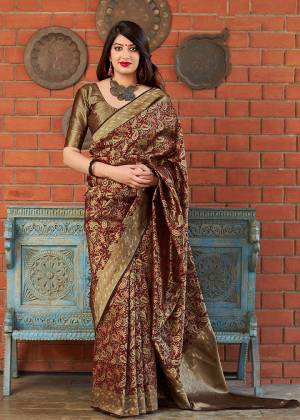 For A Royal Look, Grab This Designer Heavy Weaved Saree In Maroon Color Paired With Maroon And Gold Colored Blouse. This Saree And Blouse Are Fabricated On Banarasi Art Silk Which Gives Rich Look To Your Personality. 