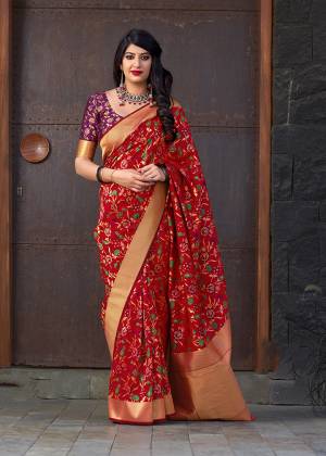 Adorn The Angelic Look Wearing This Designer Silk Based Saree In Red Color Paired With Contrasting Purple And Gold Colored Blouse. This Saree And Blouse Are Fabricated On Banarasi Art Silk. 