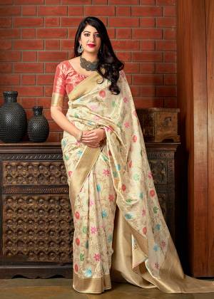 Flaunt Your Rich And Elegant Taste Wearing This Designer Saree In Cream Color Paired With Dark Peach Color. This Saree And Blouse Are Fabricated On Banarasi Art Silk Beautified With Weave. Buy This Elegant Looking Saree Now. 