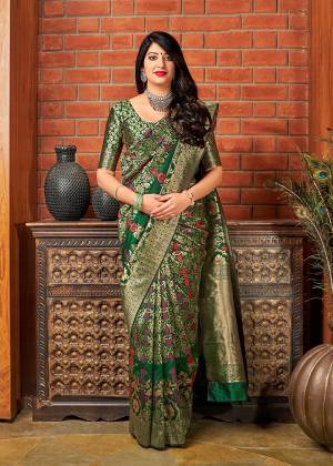 Grab This Beautiful And Attractive Looking Saree In Dark Green Color Paired With Dark Green And Gold Blouse. This Saree And Blouse are Fabricated On Banarasi Art Silk Beautified With Weave All Over. 