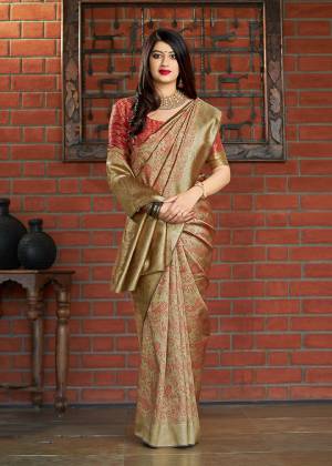 Flaunt Your Rich And Elegant Taste Wearing This Designer Saree In Beige Color Paired With Red And Gold Color. This Saree And Blouse Are Fabricated On Banarasi Art Silk Beautified With Weave. Buy This Elegant Looking Saree Now. 