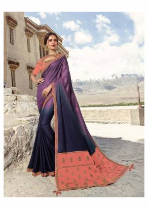 Shaded Saree Can Never Go Out Of Style, So Grab This Designer Shaded Saree In Purple And Navy Blue Color Paired With Contrasting Dark Peach Colored Blouse. This Saree And Blouse Are Fabricated On Soft Silk Beautified With Attractive Embroidery. 