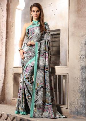 Add Some Casuals With This Pretty Saree Fabricated On Crepe. This Saree And Blouse are Beautified With prints And It Is Light Weight And Easy To Carry All Day Long