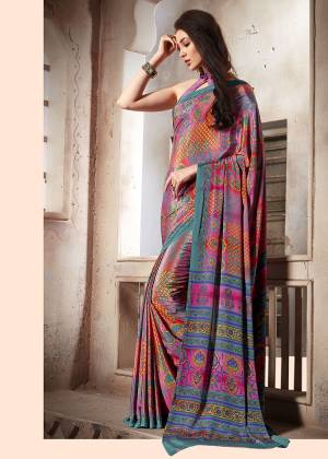 Add Some Casuals With This Pretty Saree Fabricated On Crepe. This Saree And Blouse are Beautified With prints And It Is Light Weight And Easy To Carry All Day Long