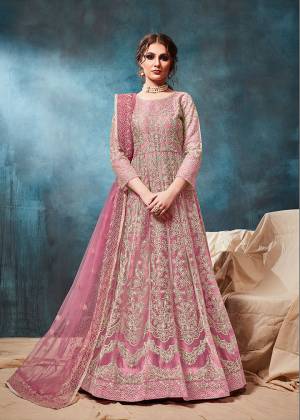 Grab This Very Beautiful and Attractive Looking Heavy Designer Floor Length Suit In Pink Color. Its Top And Dupatta Are Fabricated On Net Beautified With Coding Work Paired With Santoon Fabricated Bottom. It Is Prefectly Suitable For The Wedding And Festive Season. Buy Now.