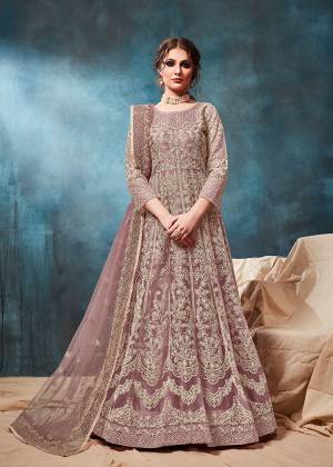 Grab This Very Beautiful and Attractive Looking Heavy Designer Floor Length Suit In Mauve Color. Its Top And Dupatta Are Fabricated On Net Beautified With Coding Work Paired With Santoon Fabricated Bottom. It Is Prefectly Suitable For The Wedding And Festive Season. Buy Now.