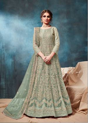 Grab This Very Beautiful and Attractive Looking Heavy Designer Floor Length Suit In Pastel Green Color. Its Top And Dupatta Are Fabricated On Net Beautified With Coding Work Paired With Santoon Fabricated Bottom. It Is Prefectly Suitable For The Wedding And Festive Season. Buy Now.