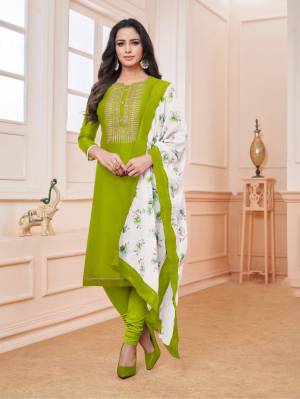 Look Beautiful Wearing This Designer Straight Suit In Parrot Green Color Paired With White Colored Dupatta. Its Top Is Fabricated On Modal Silk Paired With Cotton Bottom And Soft Cotton Fabricated Dupatta. Buy This Pretty Suit Now.