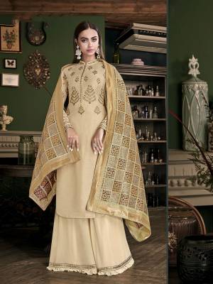 Flaunt Your Rich And Elegant Taste Wearing This Designer Straight Suit In All Over Cream Color. Its Top Is Fabricated On Satin Silk Paired With Georgette Bottom And Jacquard Silk Dupatta. It Is Light In Weight And Easy To Carry All Day Long.