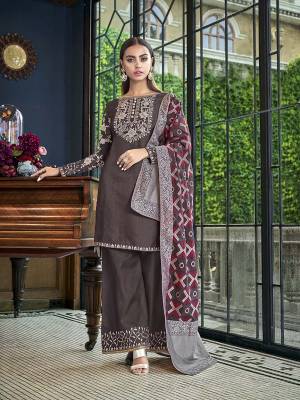 Add This Designer Piece To Your Wardrobe In Dark Grey Color Paired With Dark Grey And Multi Colored Dupatta. Its Embroidered Top And Bottom Are Fabricated On Satin Slub Paired With Jacquard Silk Fabricated Dupatta. 