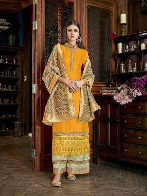 Celebrate This Festive Season With Beauty Comfort Wearing This Designer Plazzo Suit In Musturd Yellow Colored Top Paired With Contrasting Pastel Green Colored Bottom And Multi Colored Dupatta. Its Top And Bottom and Fabricated On Soft Silk Paired With Jacquard Silk Fabricated Dupatta. 