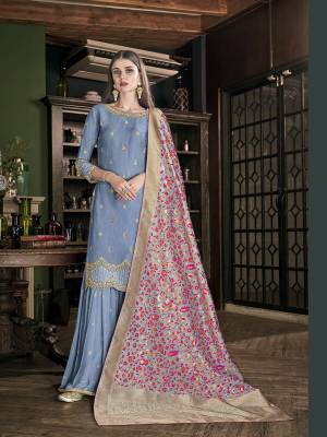 Here Is A Very Beautiful, Rich And Elegant Looking Designer Sharara Suit In Steel Blue Color Paired With Grey and Multi Colored Dupatta. Its Top Is Fabricated On Soft Art Silk Paired With Georgette Bottom And Jacquard Silk Fabricated Dupatta. Buy This Lovely Suit Now.