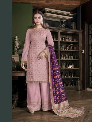 Look Pretty In This Very Beautiful Designer Suit In Baby Pink Color Paired With Contrasting Purple Colored Dupatta. Its Embroidered Top And Bottom are Fabricated On Satin Silk Paired With Jacquard Silk Fabricated Dupatta. Buy This Pretty Piece Now.