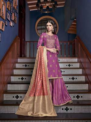 This Festive Season, Have A Beautiful Look Wearing This Designer Sharara Suit In Magenta Pink Color Paired With Multi Colored Dupatta. Its Top Embroidered Is Fabricated On Satin Silk Paired With Jacquard Silk Fabricated Bottom And Dupatta. 