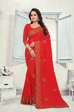 Here Is A Very Pretty Kashmiri Embroidered Designer Saree In Red Color. This Pretty Saree And Blouse Are Silk Based With Heavy Embroidered Multi Colored Lace Border. 