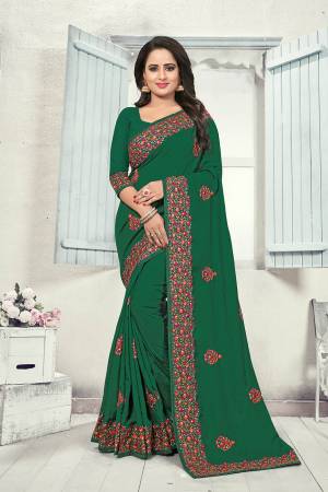 Grab This Heavy Embroidered Saree In Dark Green Color. This Saree And Blouse Are fabricated on Art Silk Beautified With Multi Colored Kashmiri Embroidery. This Pretty Saree Gives A Rich Look And It Is Suitable For Wedding And Festive Season. Buy Now.