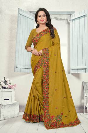 Grab This Heavy Embroidered Saree In Pear Green Color. This Saree And Blouse Are fabricated on Art Silk Beautified With Multi Colored Kashmiri Embroidery. This Pretty Saree Gives A Rich Look And It Is Suitable For Wedding And Festive Season. Buy Now.