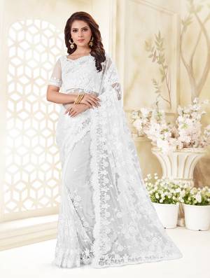 Here Is A Very Beautiful And Heavy Designer Saree In White Color. This Beautiful Heavy Embroidered Saree And Blouse Are Fabricated On Net Beautified With Pretty Tone To Tone Resham Embroidery And Ceramic Stone Work. Buy This Heavy Yet Subtle Looking Saree Now.
