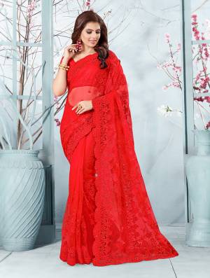Here Is A Very Beautiful And Heavy Designer Saree In Red Color. This Beautiful Heavy Embroidered Saree And Blouse Are Fabricated On Net Beautified With Pretty Tone To Tone Resham Embroidery And Ceramic Stone Work. Buy This Heavy Yet Subtle Looking Saree Now.