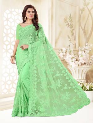 Here Is A Very Beautiful And Heavy Designer Saree In Light Green Color. This Beautiful Heavy Embroidered Saree And Blouse Are Fabricated On Net Beautified With Pretty Tone To Tone Resham Embroidery And Ceramic Stone Work. Buy This Heavy Yet Subtle Looking Saree Now.