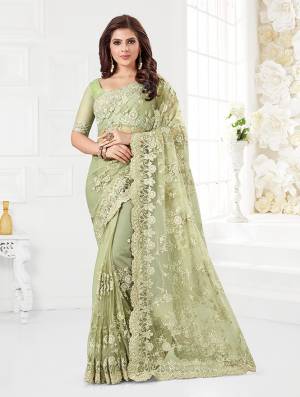 Here Is A Very Beautiful And Heavy Designer Saree In Mint Green Color. This Beautiful Heavy Embroidered Saree And Blouse Are Fabricated On Net Beautified With Pretty Tone To Tone Resham Embroidery And Ceramic Stone Work. Buy This Heavy Yet Subtle Looking Saree Now.