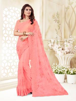 Here Is A Very Beautiful And Heavy Designer Saree In Pink Color. This Beautiful Heavy Embroidered Saree And Blouse Are Fabricated On Net Beautified With Pretty Tone To Tone Resham Embroidery And Ceramic Stone Work. Buy This Heavy Yet Subtle Looking Saree Now.
