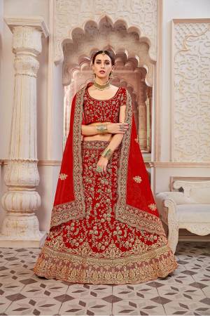 Get Ready For Your D-Day With This Heavy Designer Lehenga Choli In All Over Red Color. This Heavy Embroidered Lehenga Choli Is Fabricated On Velvet Paired With Net Fabricated Dupatta. It Is Beautified With Heavy Coding Jari Embroidery. Buy This Bridal Lehenga Now.?