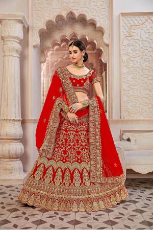 If You Want To Become The Most Attractive And Elegant Bride, Than?Grab This Heavy Designer Lehenga Choli In All Over Red Color. Its Heavy Embroidered Lehenga And Choli Are Fabricated On Velvet Paired With Net Fabricated Dupatta. It Beautiful Rich Color And Clean Embroidery Will Earn You lots Of Compliments From Onlookers.