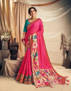 This eternally youthful and dazzling Dark pink saree will take your ethnic fashion a notch higher in no time. Pair with traditional tasseled choker to add a modern appeal.  