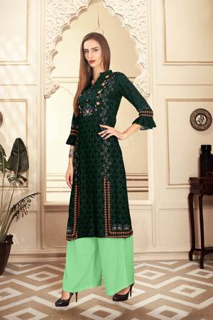 Add This Pretty Pair Of Readymade Kurti And Plazzo To Your Wardrobe In Dark Green And Light Green Color. This Pair Is Fabricated On Rayon Cotton Beautified With Digital Prints. 