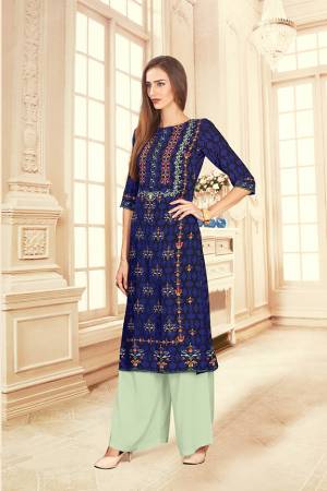 Grab This Beautiful Readymade Pair Of Kurti And Plazzo In Royal Blue And Pastel Green Color. This Pair Is Rayon Cotton Based Beautified With Digital Prints Over The Kurti. 