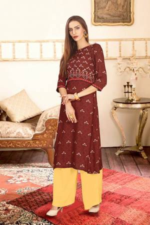 Add This Pretty Pair Of Readymade Kurti And Plazzo To Your Wardrobe In Maroon And Yellow Color. This Pair Is Fabricated On Rayon Cotton Beautified With Digital Prints. 