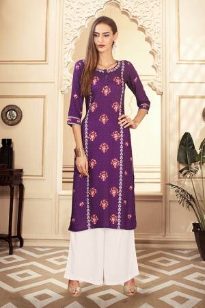 For Your Semi-Casuals, Grab This Designer Readymade Pair Of Kurti And Plazzo In Purple And White Color. This Pretty Pair Is Fabricated On Rayon Cotton. Its Pretty Kurti Is Beautified With Digital Prints. Buy Now.