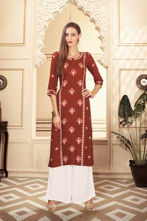 Grab This Beautiful Readymade Pair Of Kurti And Plazzo In Rust Brown And White Color. This Pair Is Rayon Cotton Based Beautified With Digital Prints Over The Kurti. 